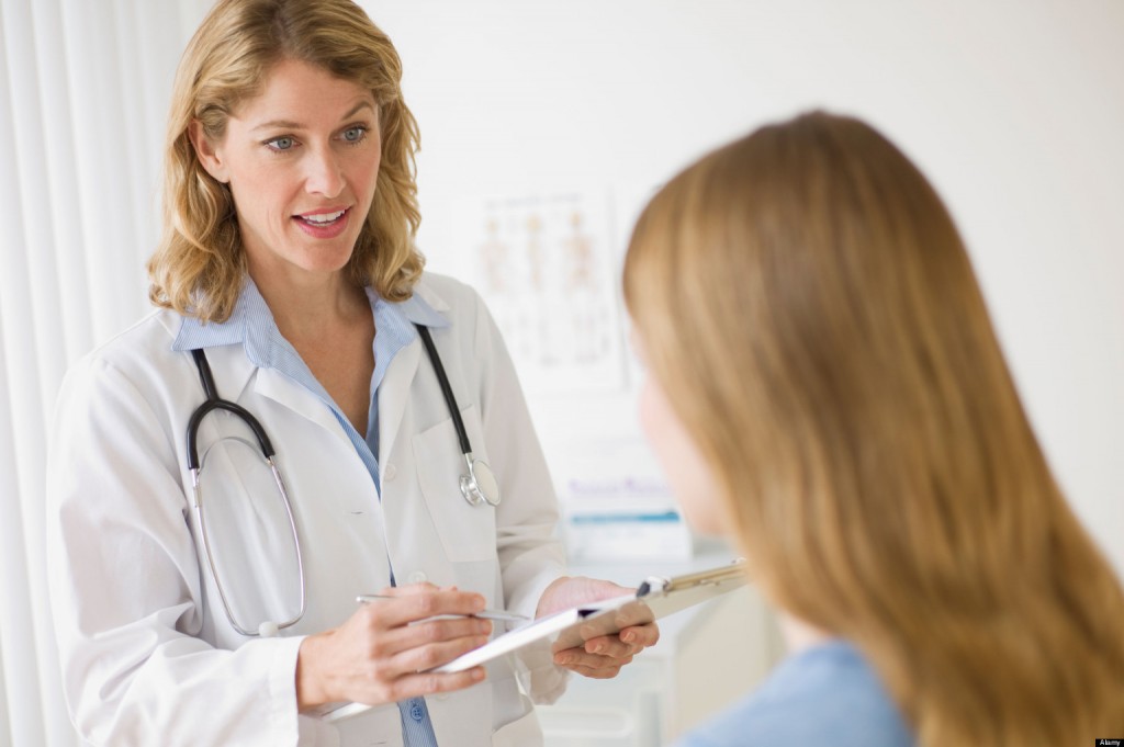 BNWWMK Doctor talking to patient in exam room. Image shot 2010. Exact date unknown.